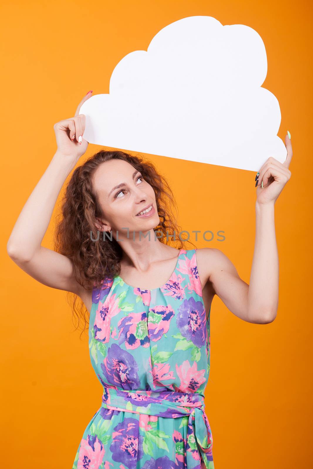 Gorgeous young woman looking up on her bubble thought. Caucasian woman holding empty sign.