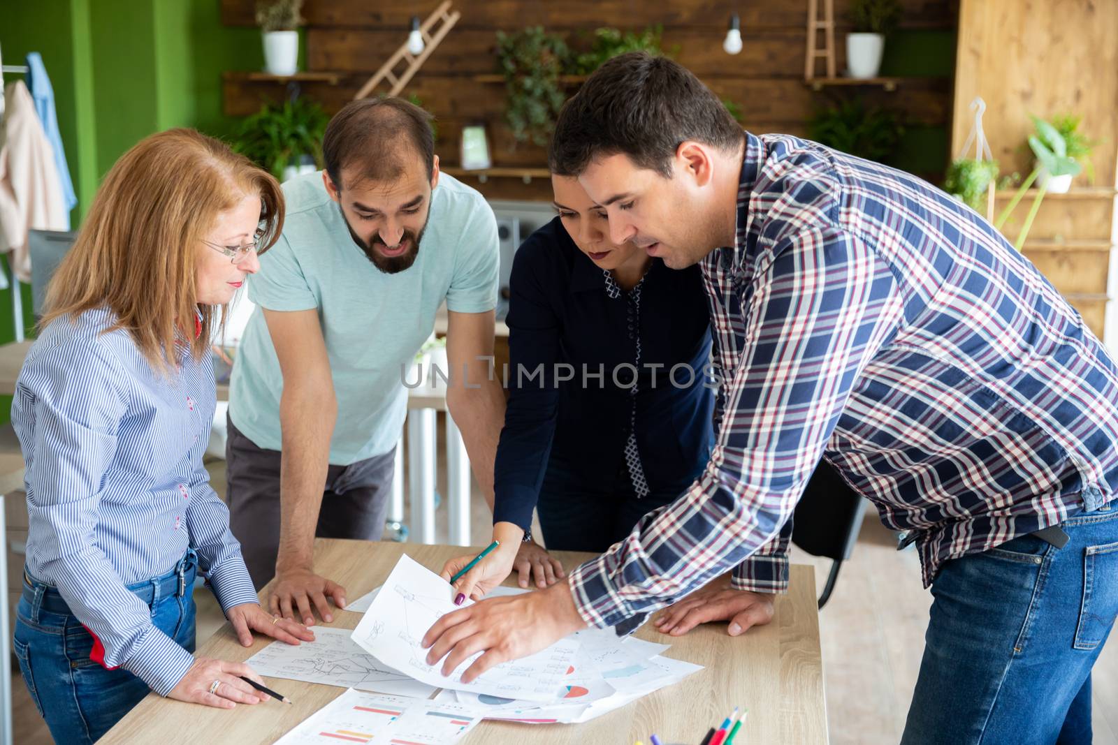Employees explain to the manager their ideas about the project. Teamwork and strategy