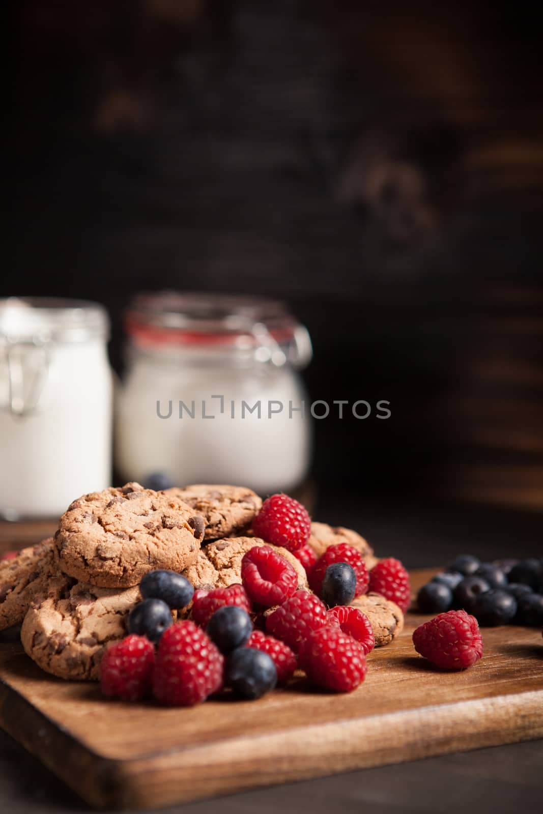 Tasty treat made of homemade chocolate chips with blueberries. Sweet snack.