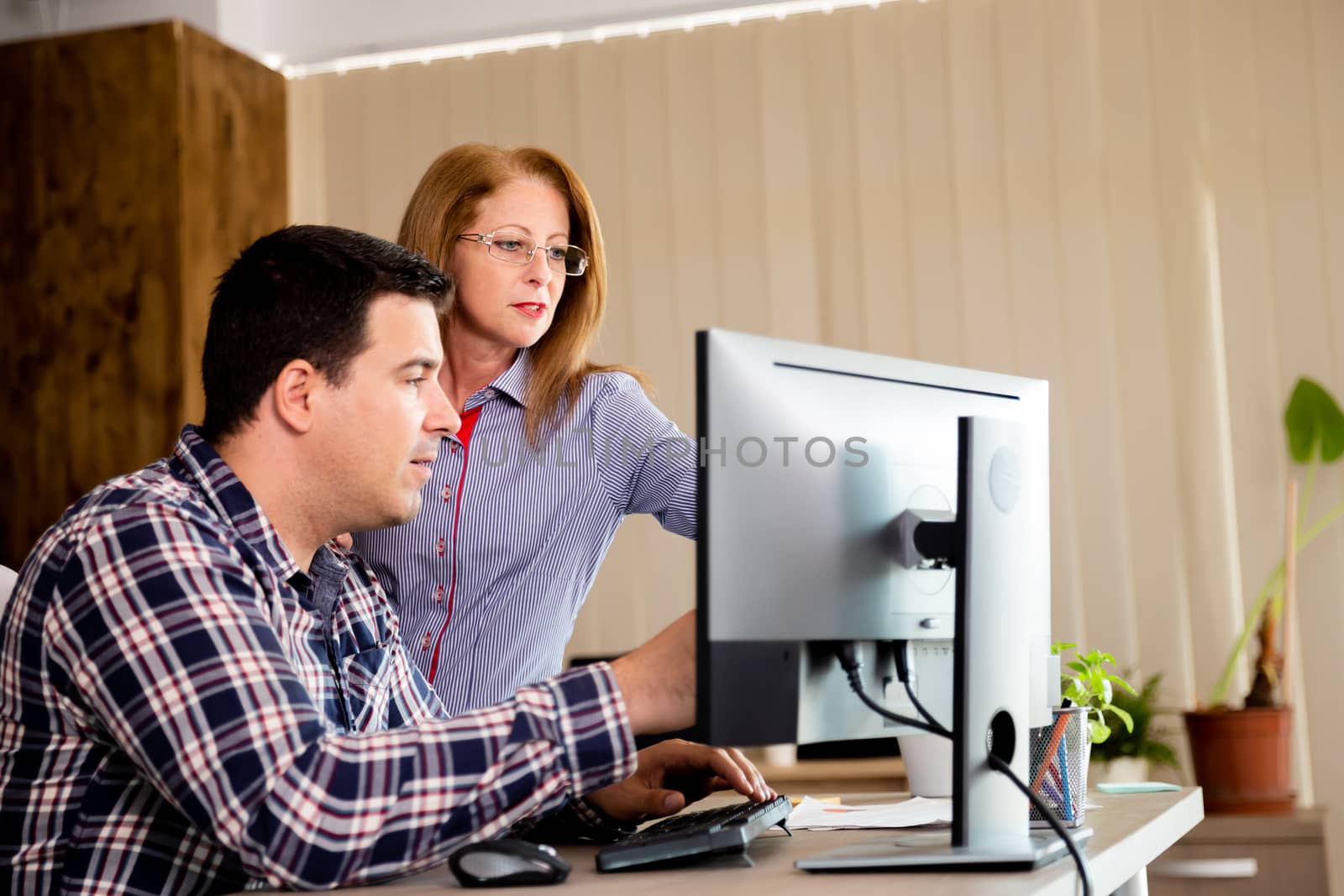 Creative team talking in the office. Business team in office working on new project