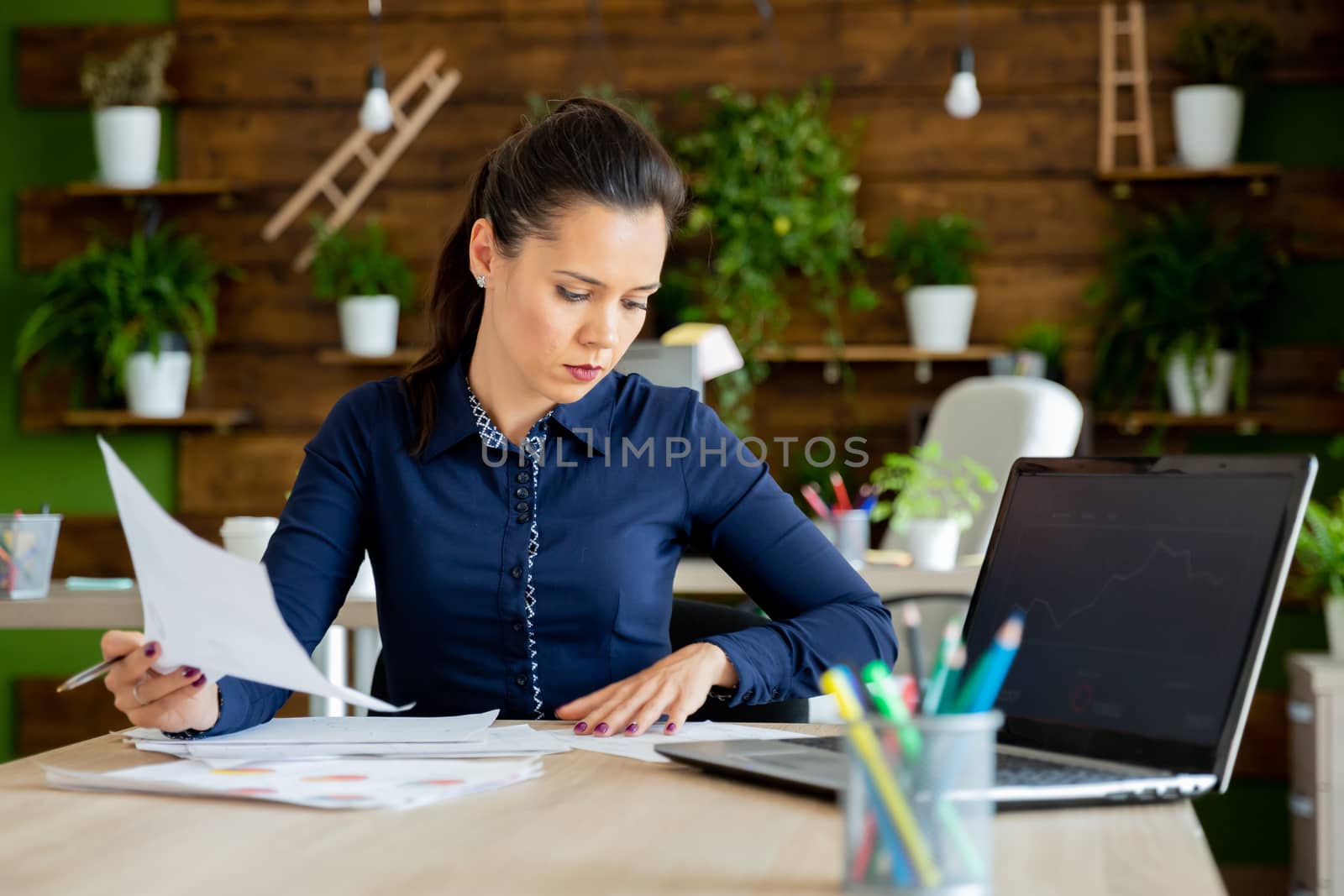 Businesswoman read the company report.Cozy office