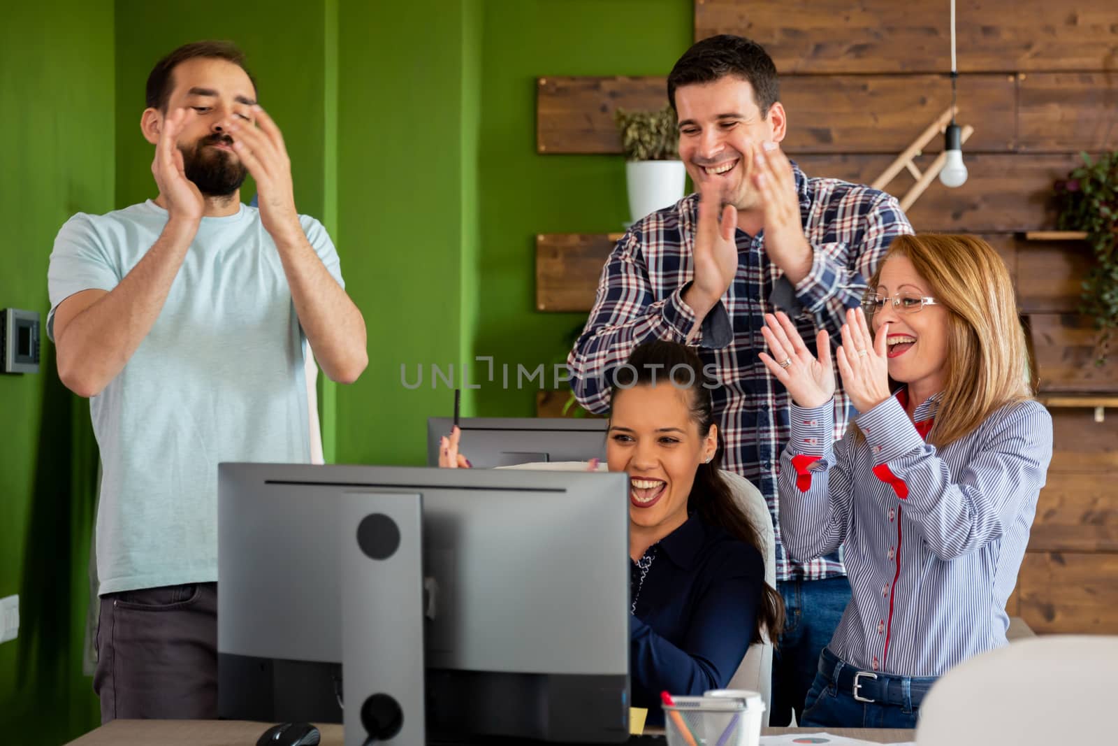 Happy creative team in office. Business, startup, design, people and teamwork concept
