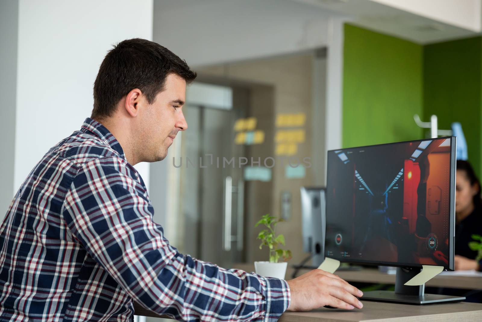 Man playing video games during the program. Using the computer at work