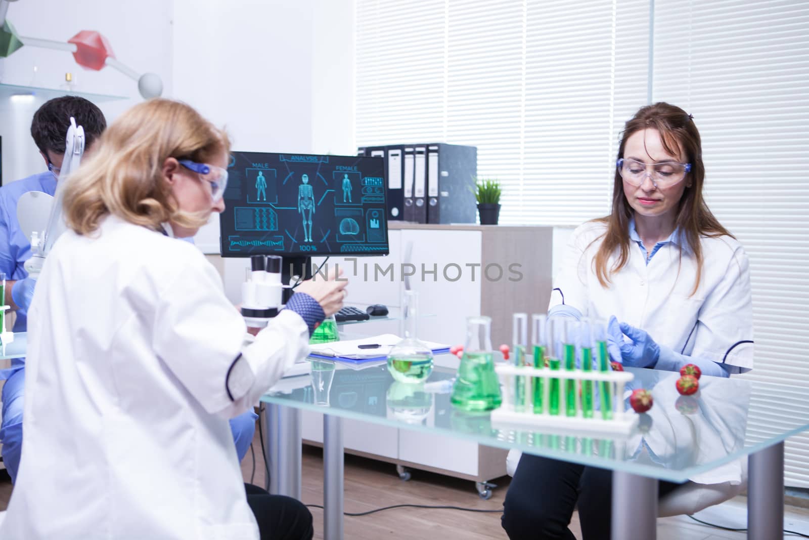 Team of different ages of scientist team in a research lab. Quality inspection.
