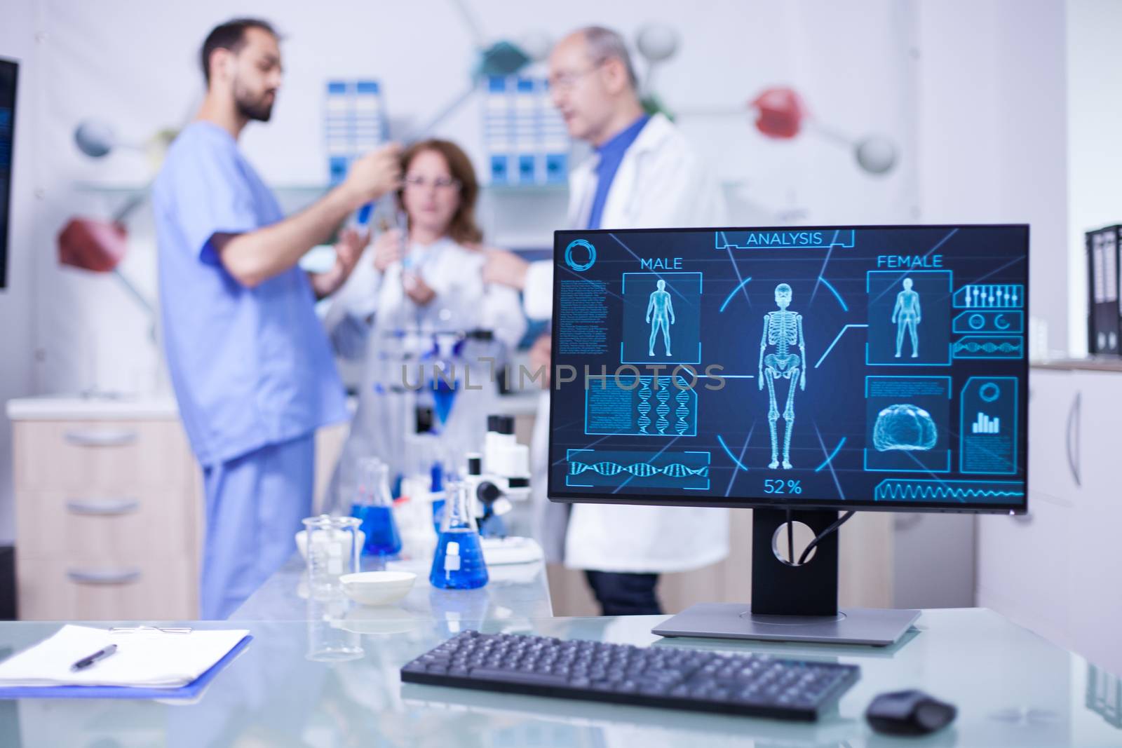 Advanced human body research displayed monitor in laborator. Researchers in human health.