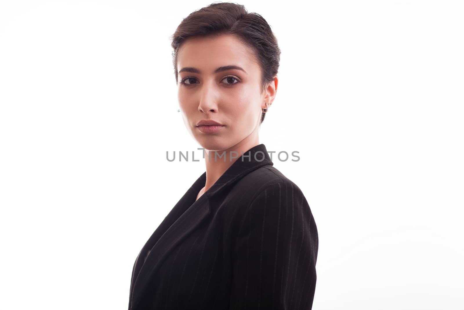 Caucasian beautiful young woman with a costume jacket on it over white background. Girl posing in costume jacket.