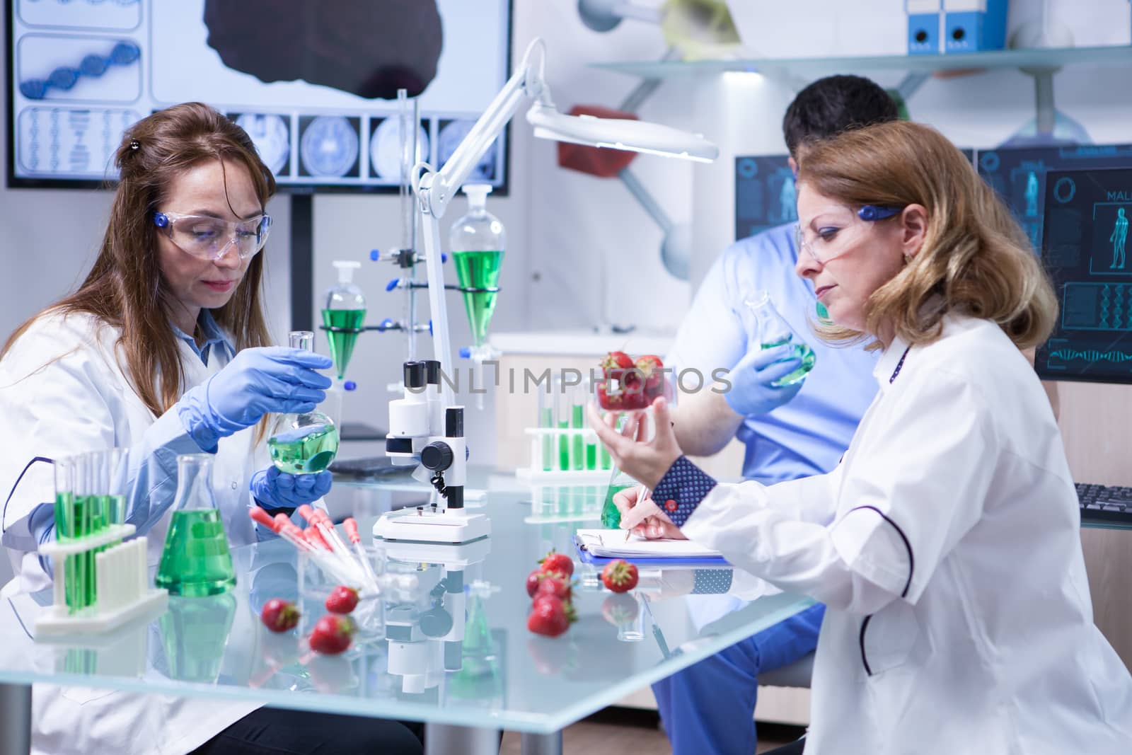 Team of caucasian scientist working together agriculture industry. Quality control.