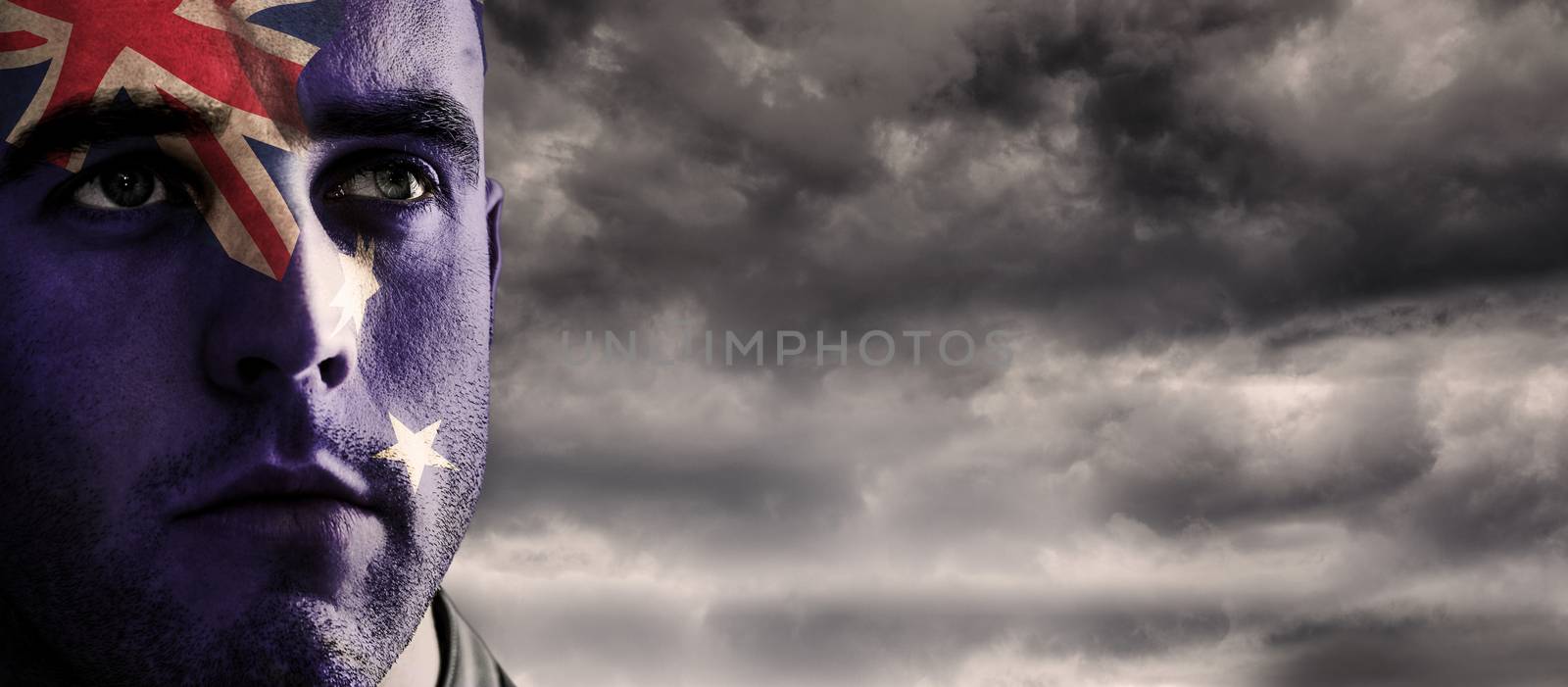 New Zealand rugby player against stormy sky