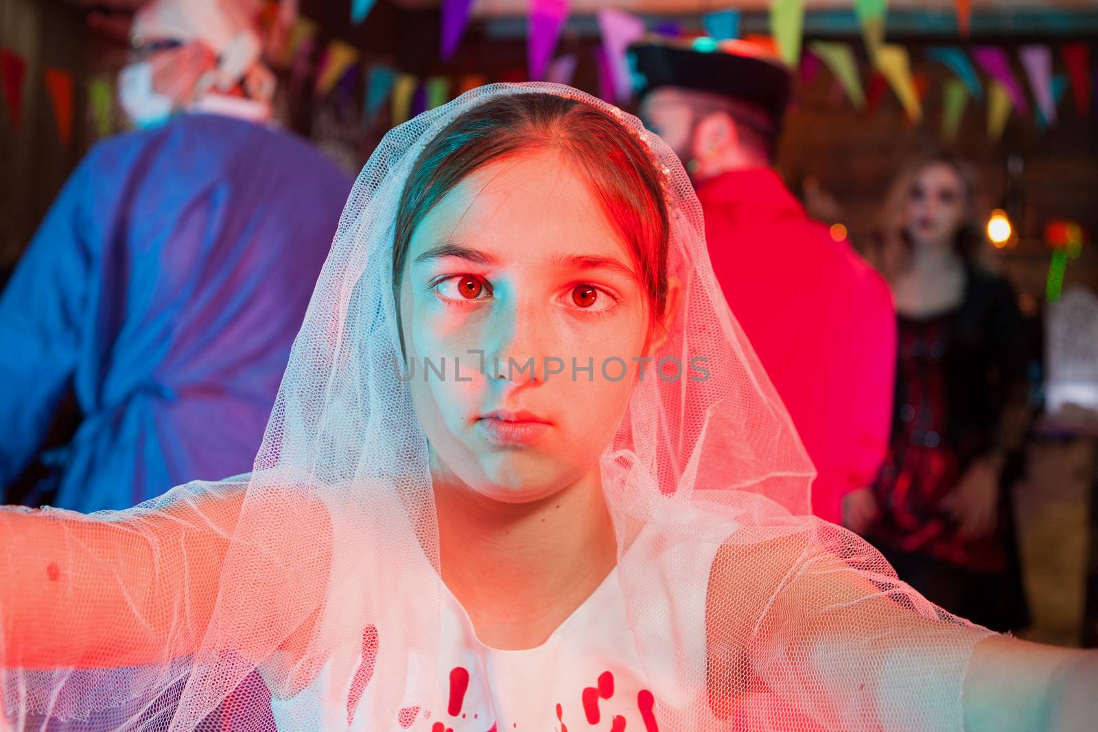 Beautiful little girl in a weeding dress at halloween carnival by DCStudio