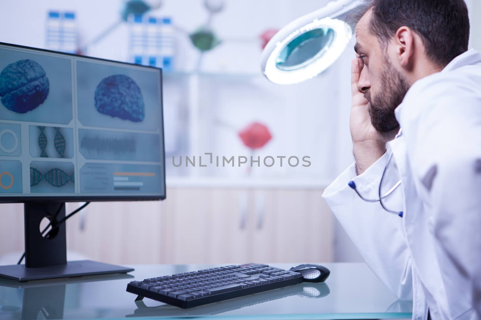 Doctor in a hospistal laboratory reading a braing x-ray. Modern medicine.