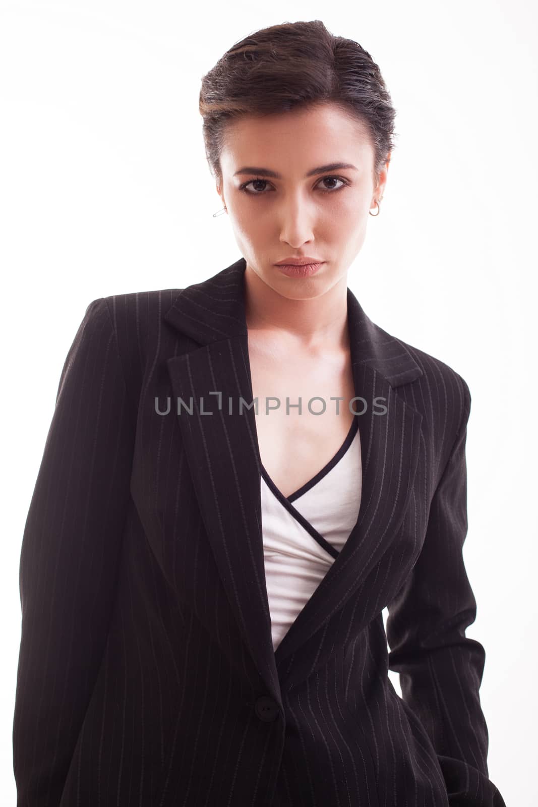 Young female with short hair wearing a stylish jacket in studio over white background. Gorgeous young female.