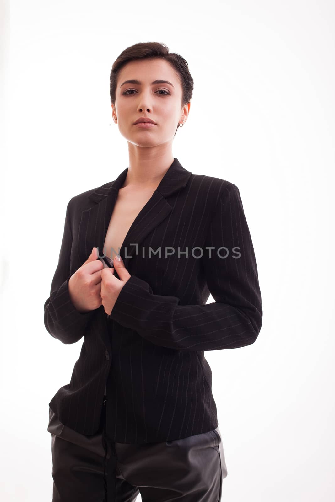 Gorgeous Young woman wearing a black jacket insolated over white background. Casual clothing. Attractive young woman