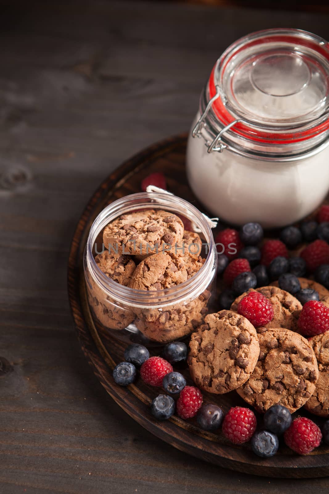 Top view of healthy and delicious chocolate biscuits with fresh bluebarries. Healthy snack.