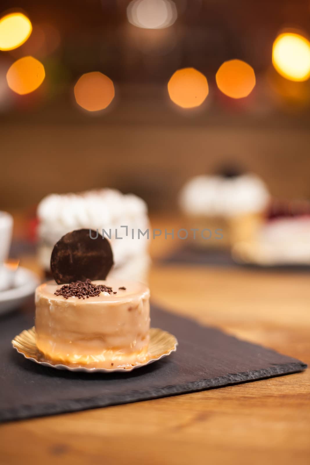 Delicious mini cake with crumbles of chocholate and tasty biscuit on top. Delicious cake baked with traditional ingredients.