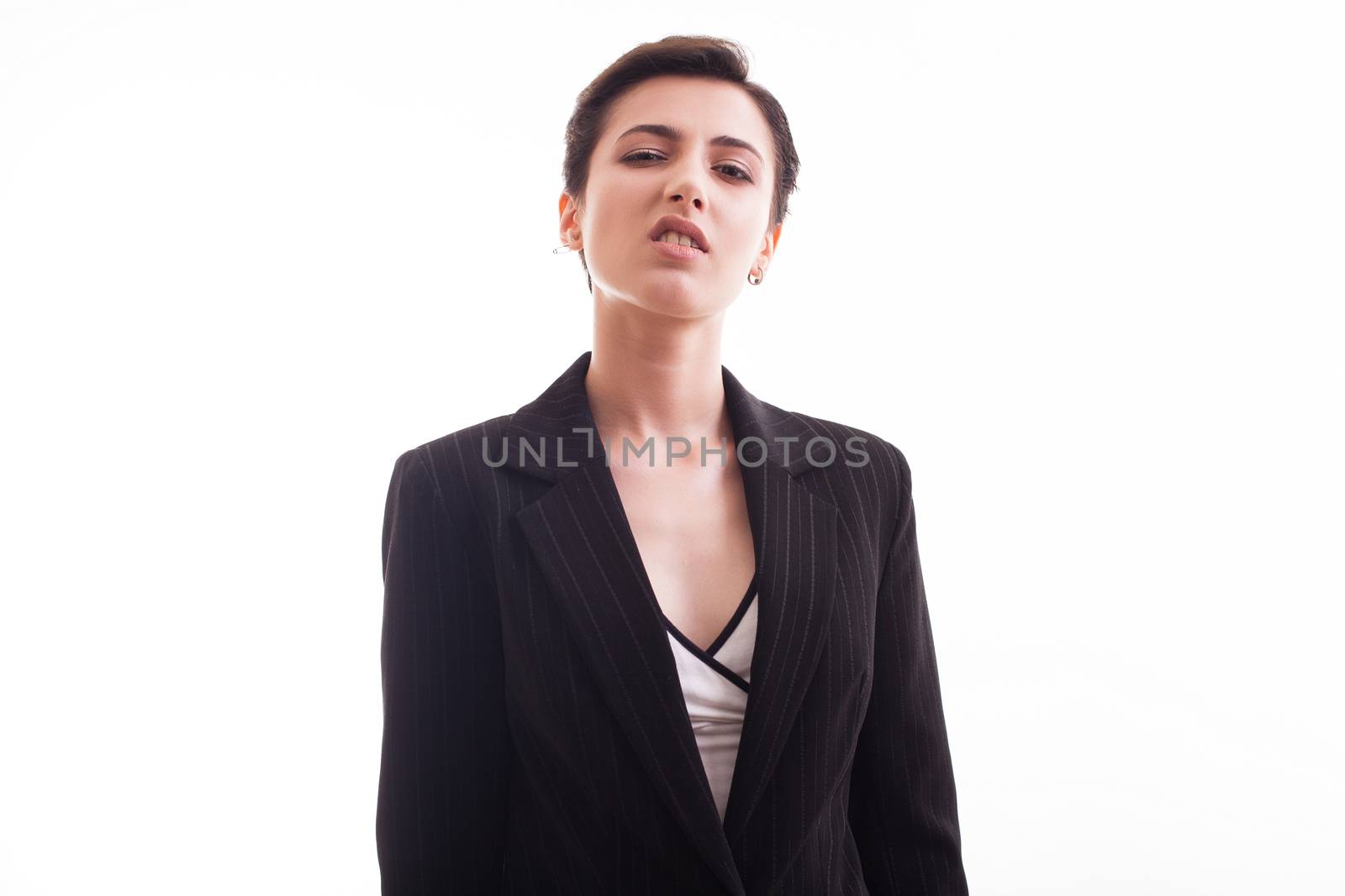 Portraif of fashion model in her 20s wearing a black jacket in studio over white background. Cute girl.
