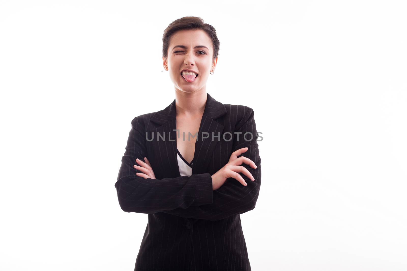 Fashion model in her 20s winking to the camera wearing a black jacket. Joyfull young female.