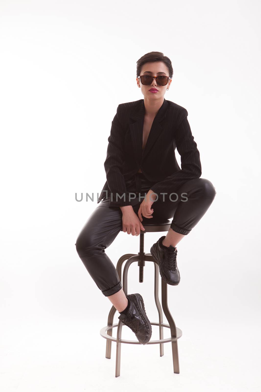 Full body portrait of stylish caucasian fashion model with stylish clothes. Fashion model with sunglasses.
