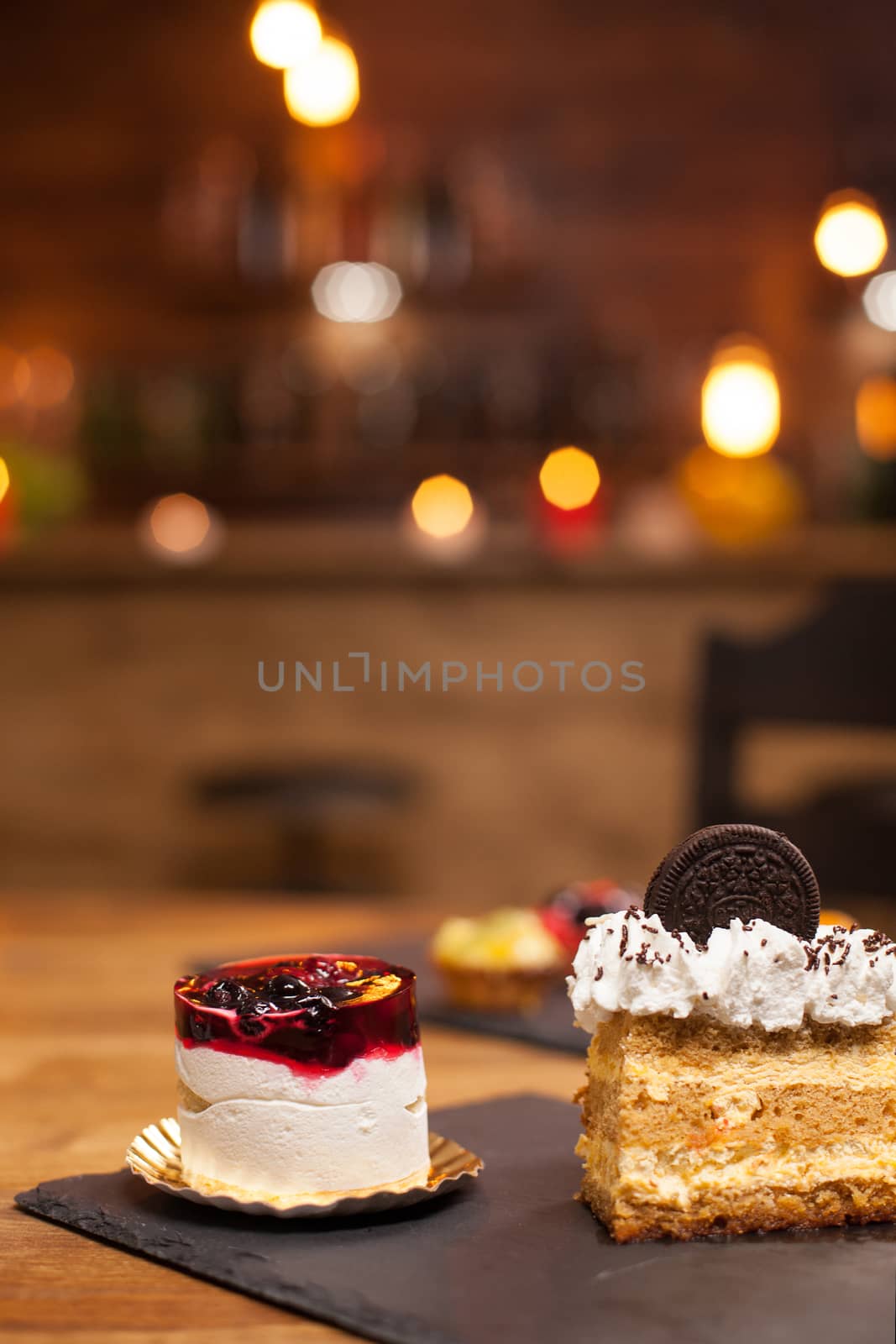 Homemade dessert with fresh fruits and savory cream on top. Delious cakes with no sugar. Tasty cake with biscuit on top . Cake with lemon cream in the middle