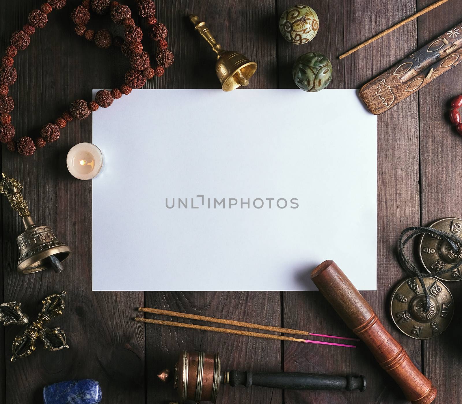 blank white sheet in the middle of religious objects for meditat by ndanko