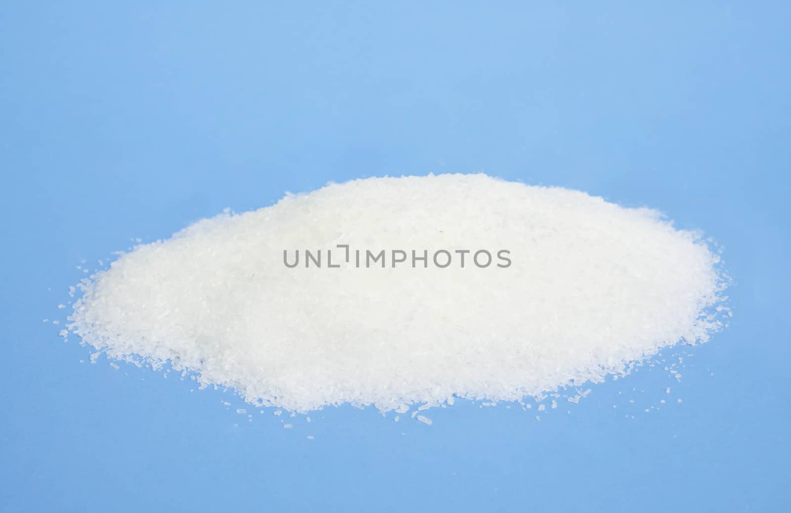 Monosodium glutamate on light blue background