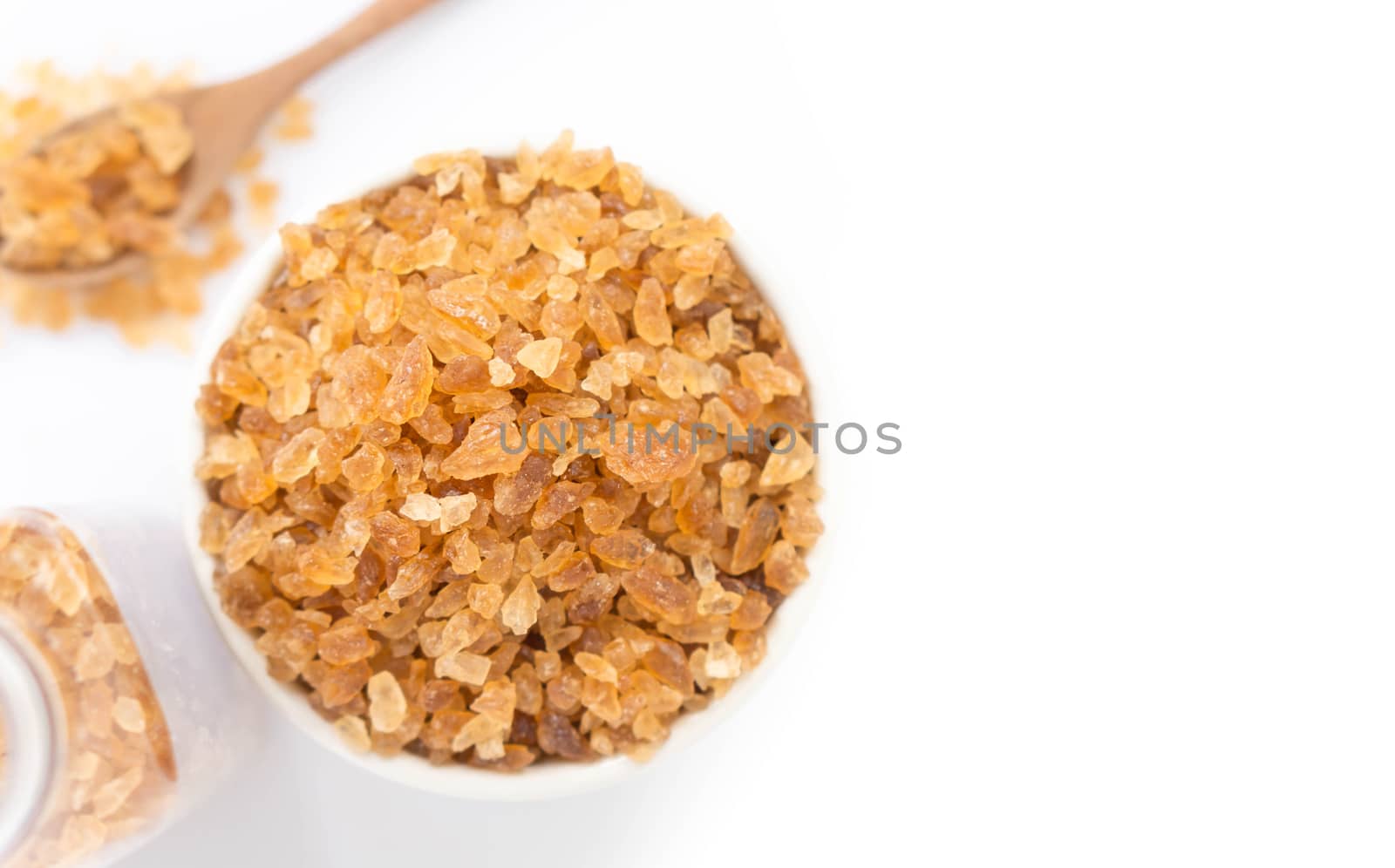 Closeup brown sugar on ceramic bowl isolated with white backgrou by pt.pongsak@gmail.com