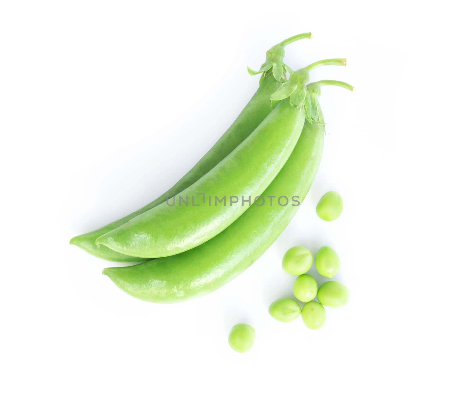 Closeup top view fresh green peas isolated on white background, healthy food concept