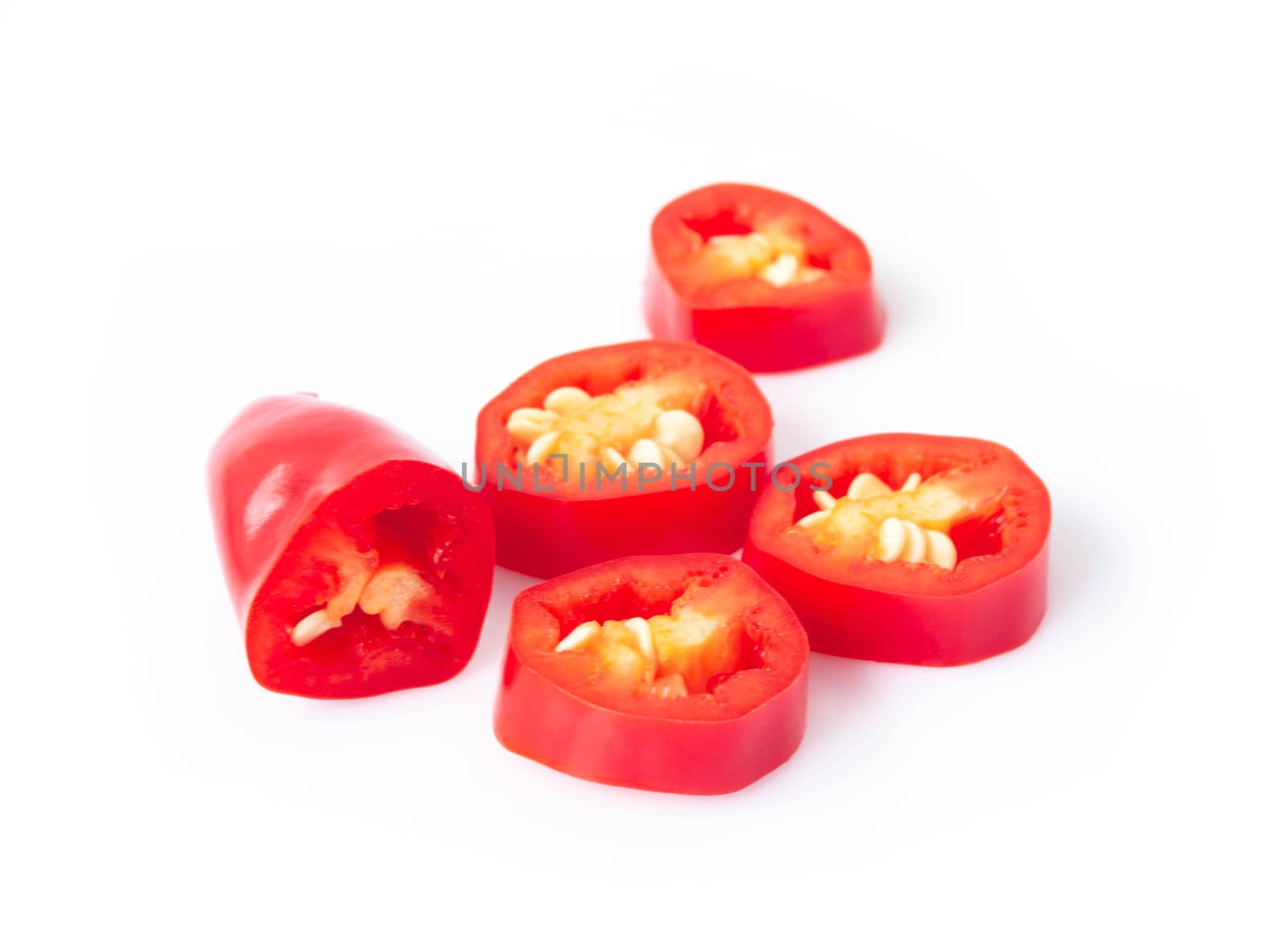 Red chili pepper sliced on white background, raw food ingredient concept
