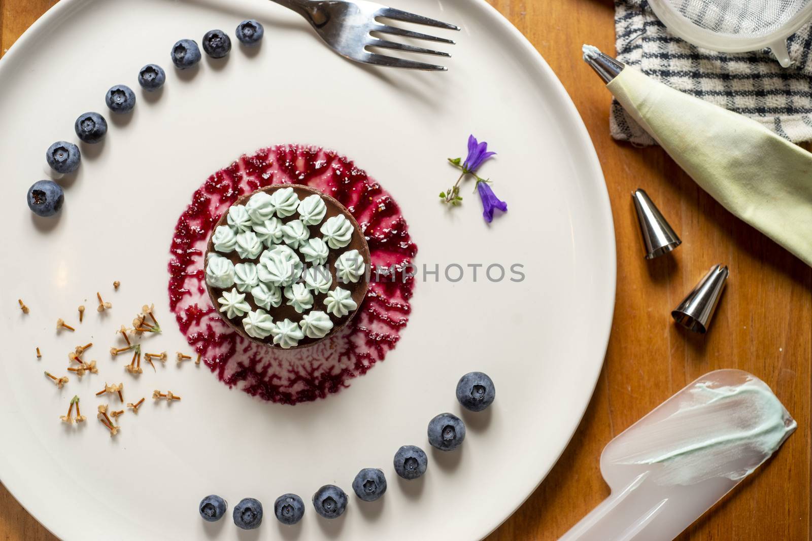 Appetizing and colorful dessert on a white plate, flat lay. by tamas_gabor