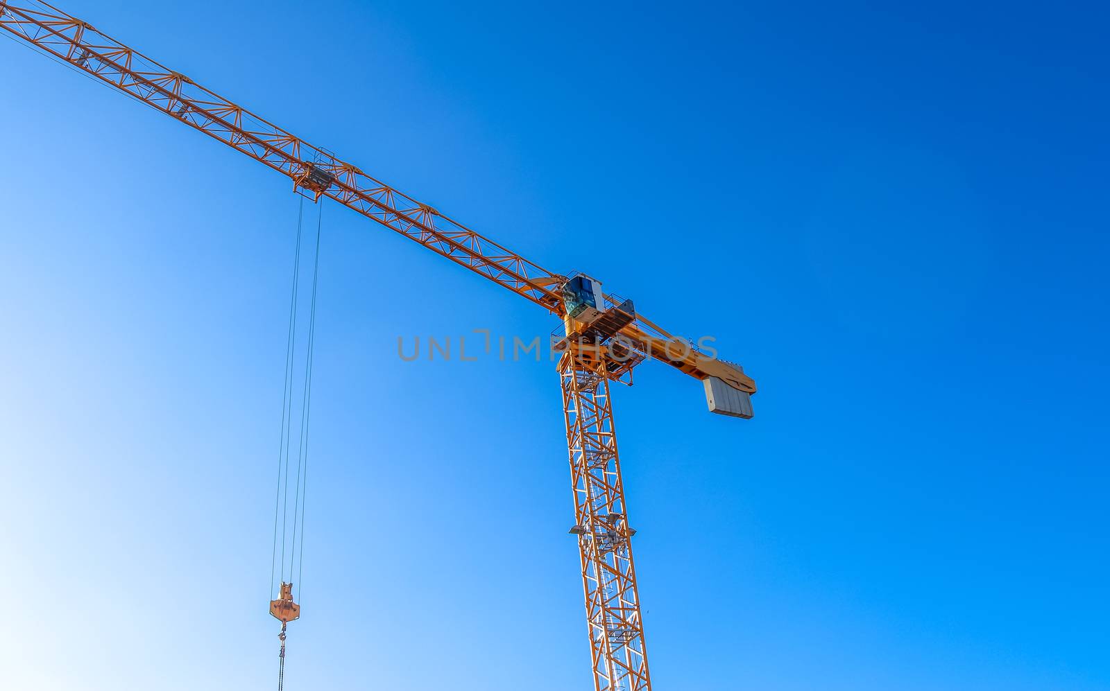 Several cranes on constructions sites at high buildings all over Europe.