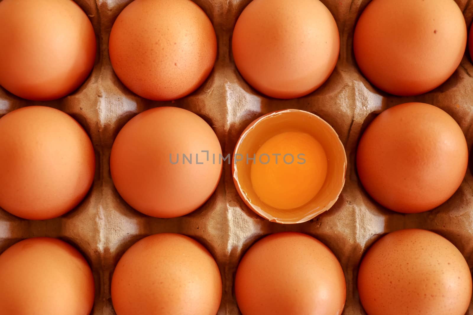 tray of raw eggs on background. Top view.