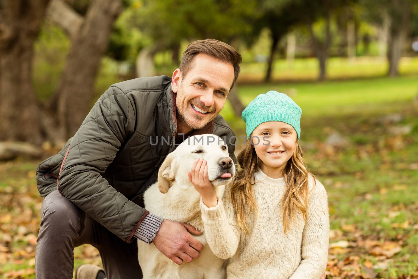 Young family with a dog by Wavebreakmedia