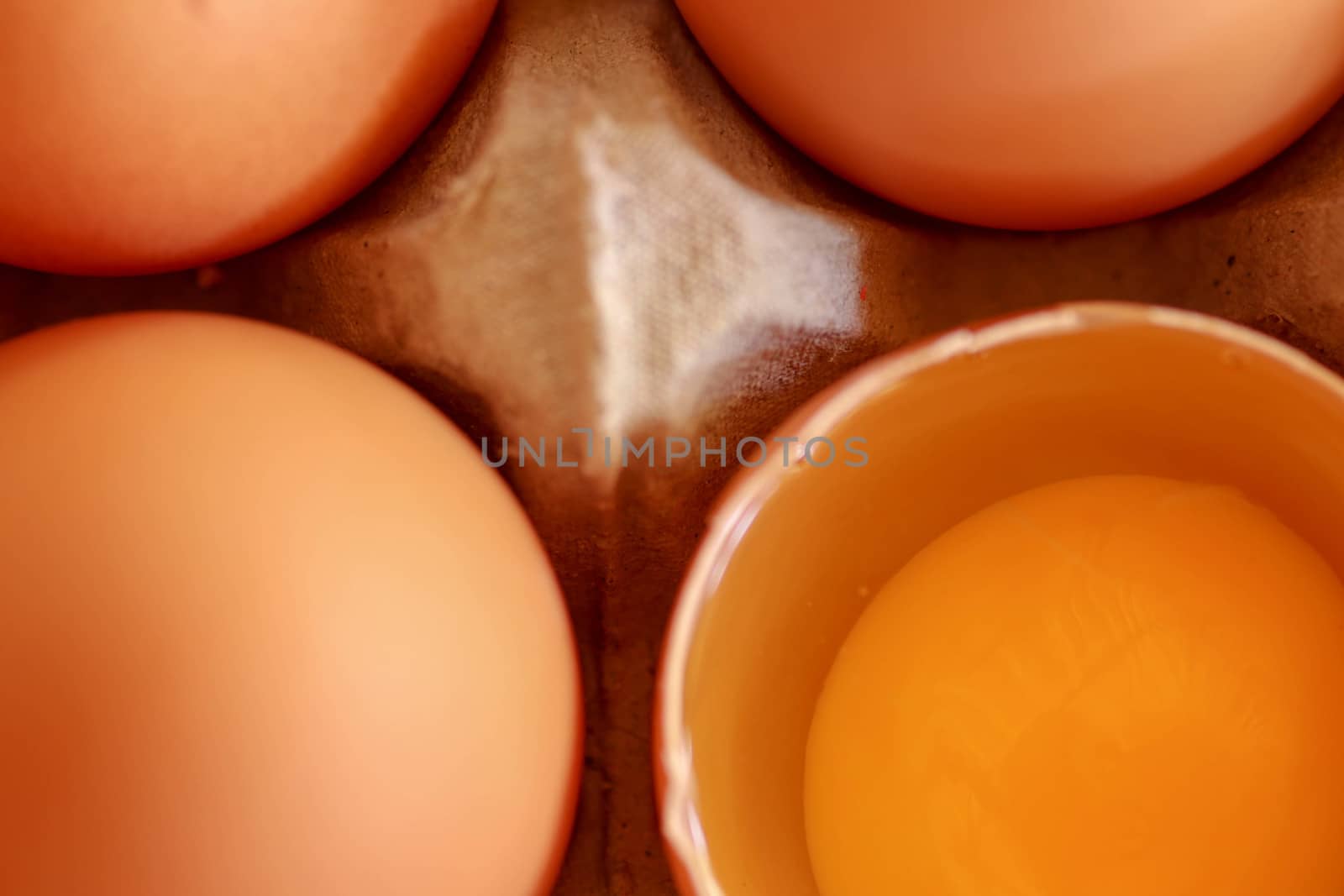 tray of raw eggs on background. Top view by Sanatana2008