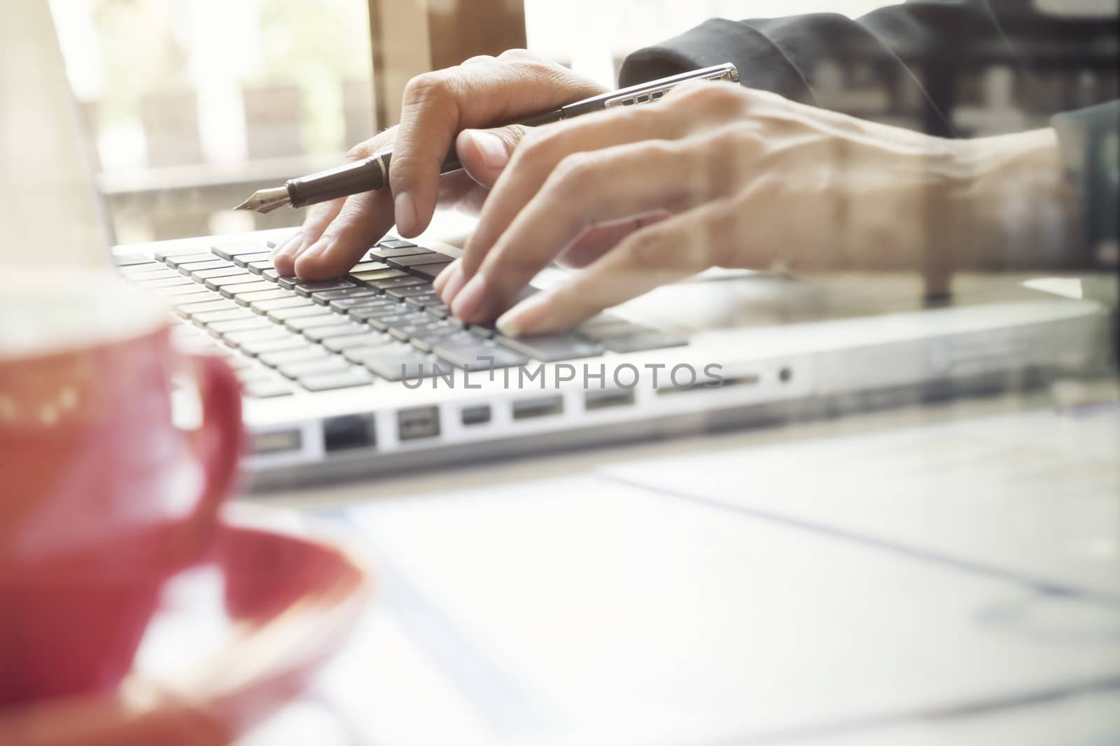 Business woman's hands typing on laptop keyboard. by ijeab