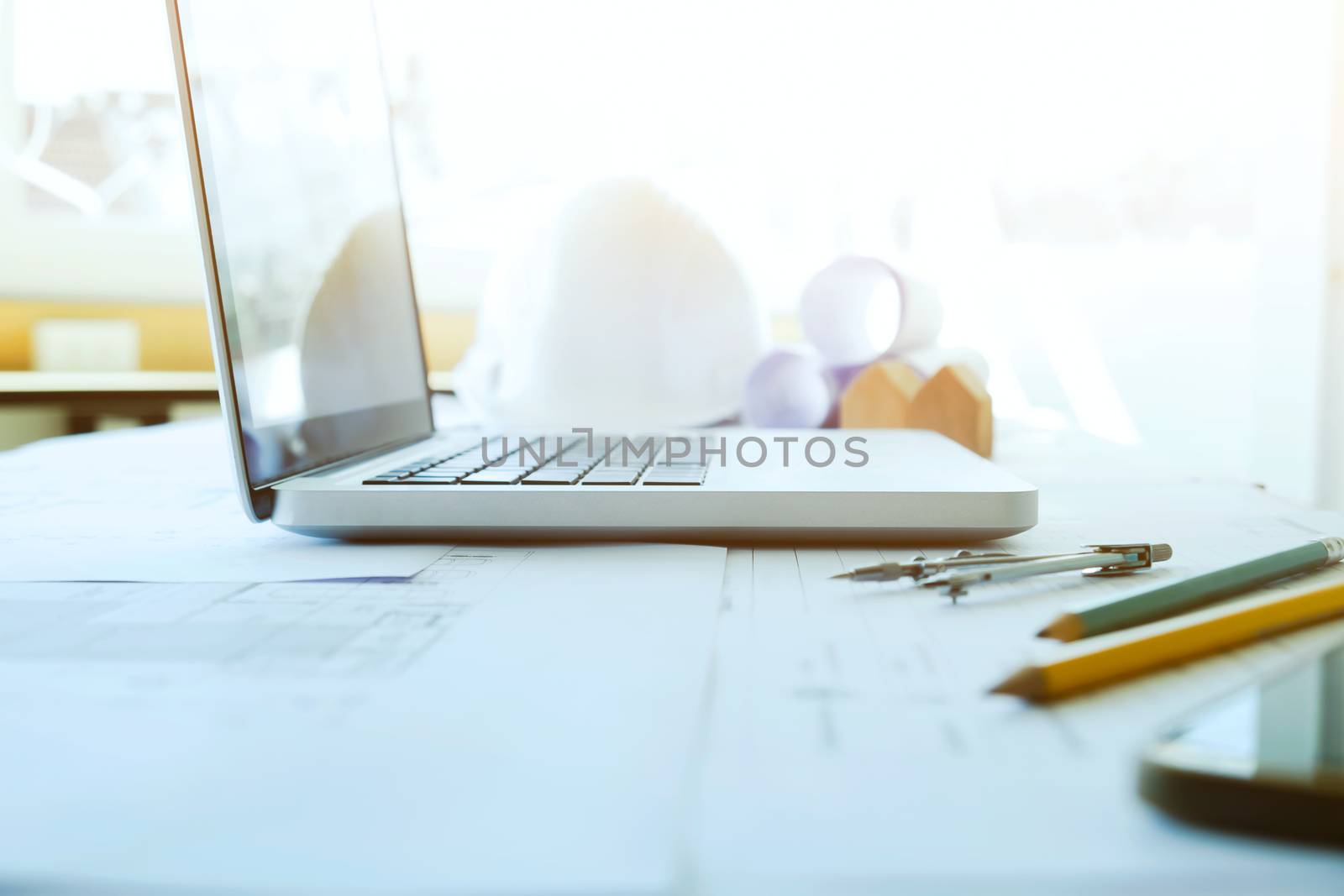 Construction and Repair work. Drawings for building Architectural project, blueprint rolls and divider compass on table. Engineering tools concept. Copyspace of Architecture and Engineer Desktop.