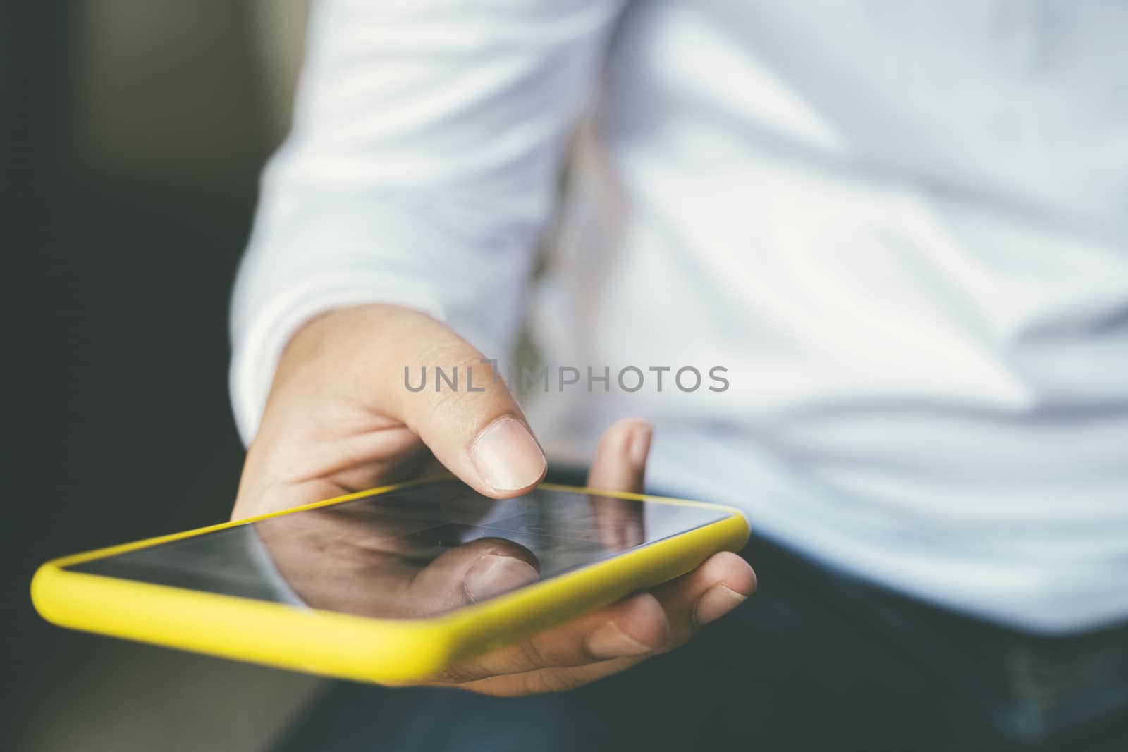 Close up of man using mobile phone. by ijeab