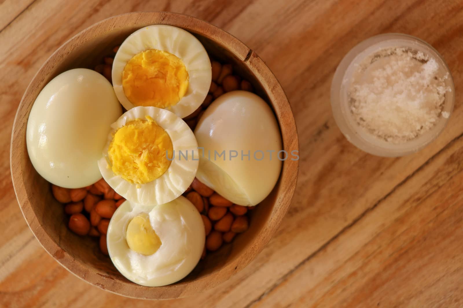 Boiled egg on a wooden background. Kind from above.