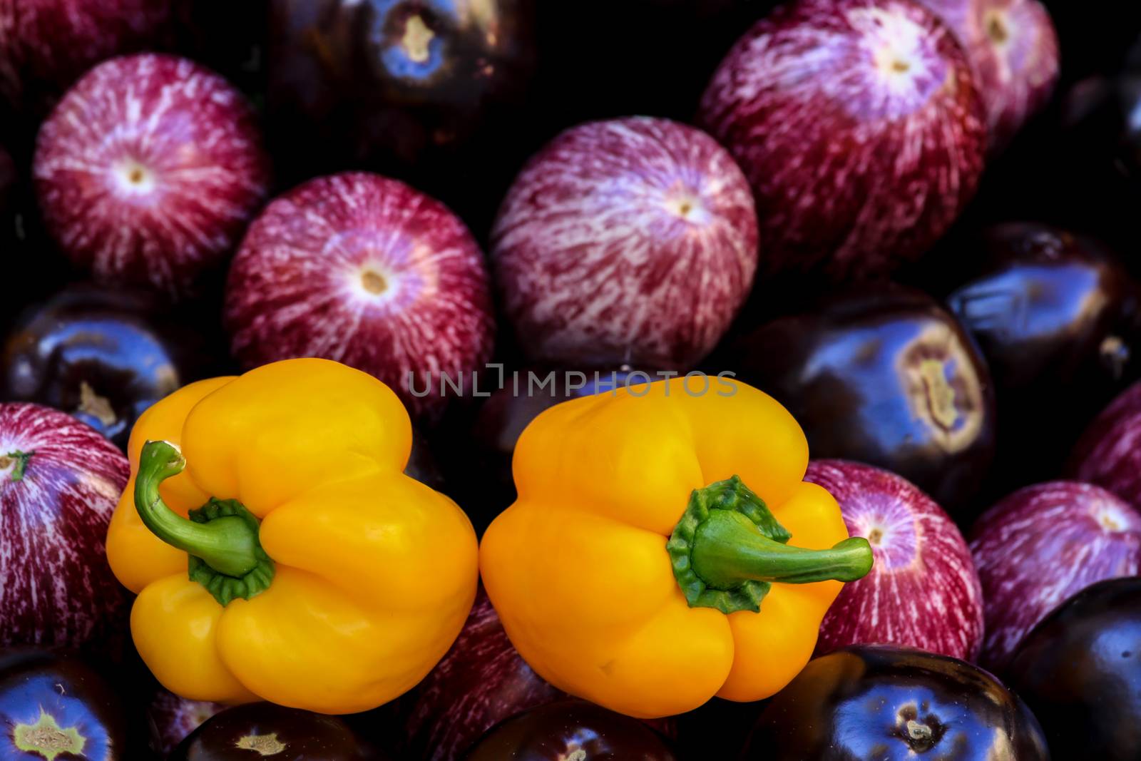 Fresh yellow peppers,with aubergines
	
