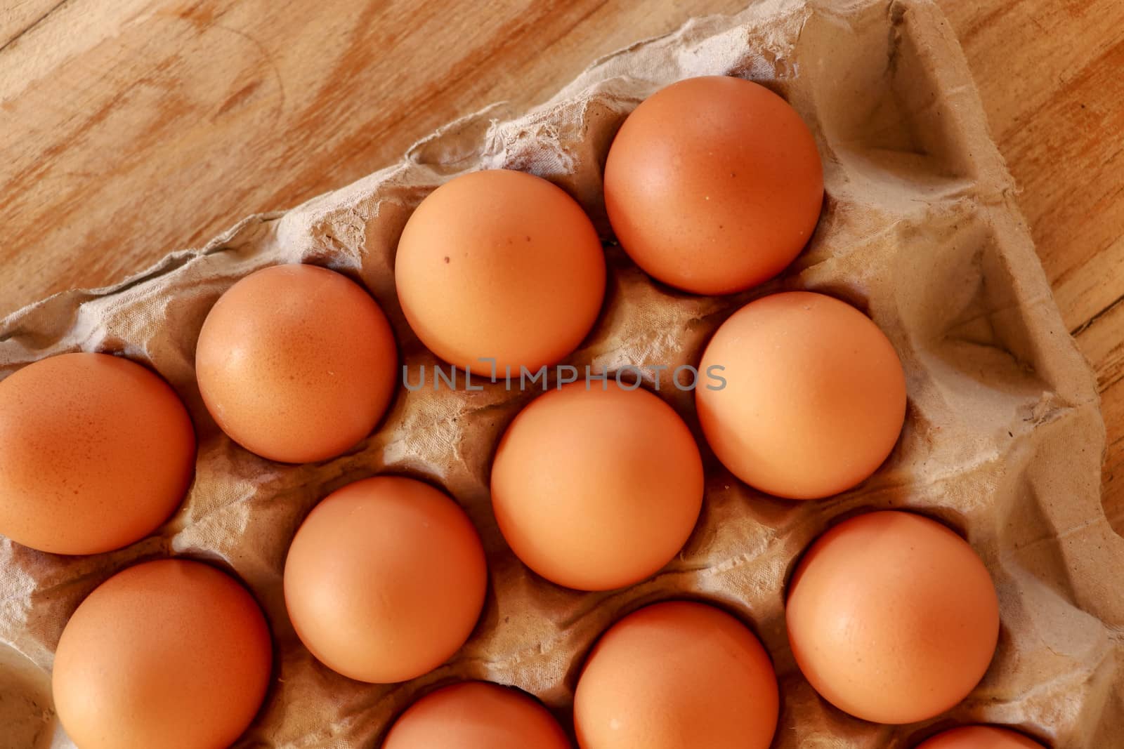 Thirty brown chicken eggs in a cardboard tray packaging. Raw fre by Sanatana2008