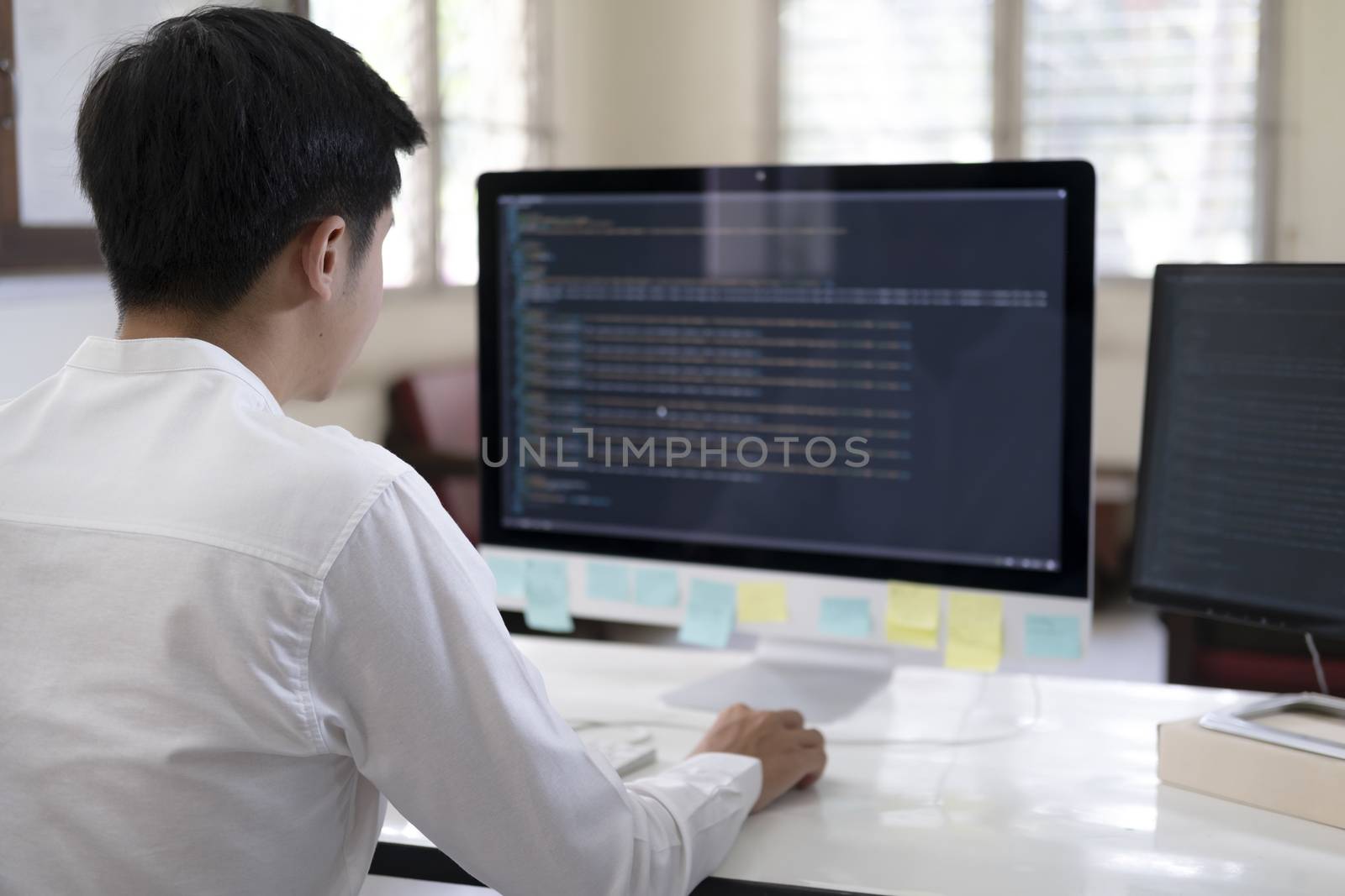 Programmer is coding and programming software by ijeab