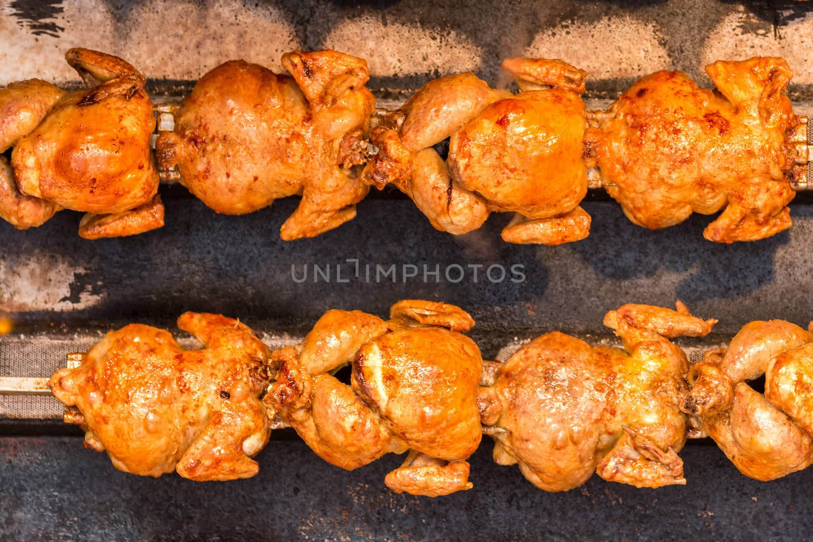 Whole  chicken rotate on the grill