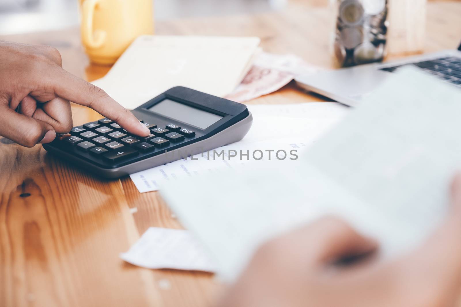 Finances Saving Economy concept. Accountant or banker calculate the cash bill.