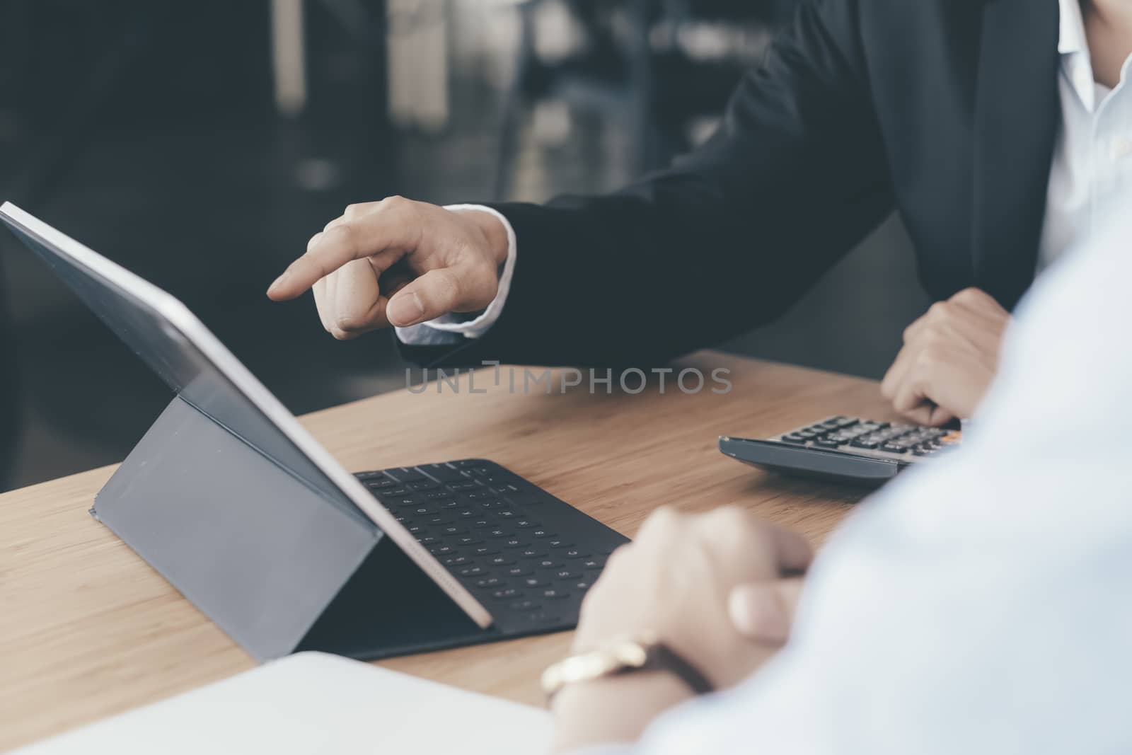 Businessmen teamwork meeting to discuss the investment. by ijeab