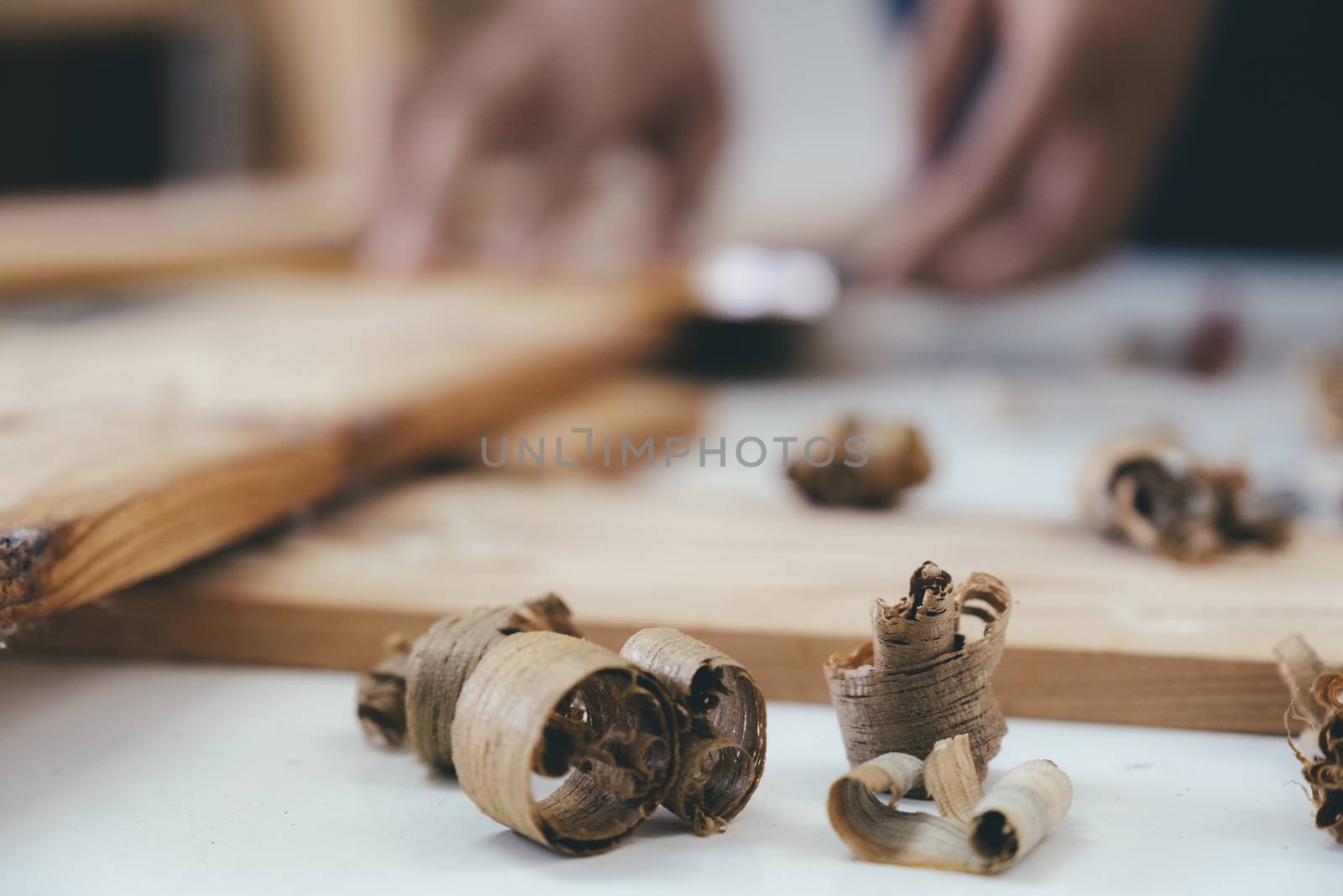 Close up of wood shavings on the carpenter's workbench.  by ijeab