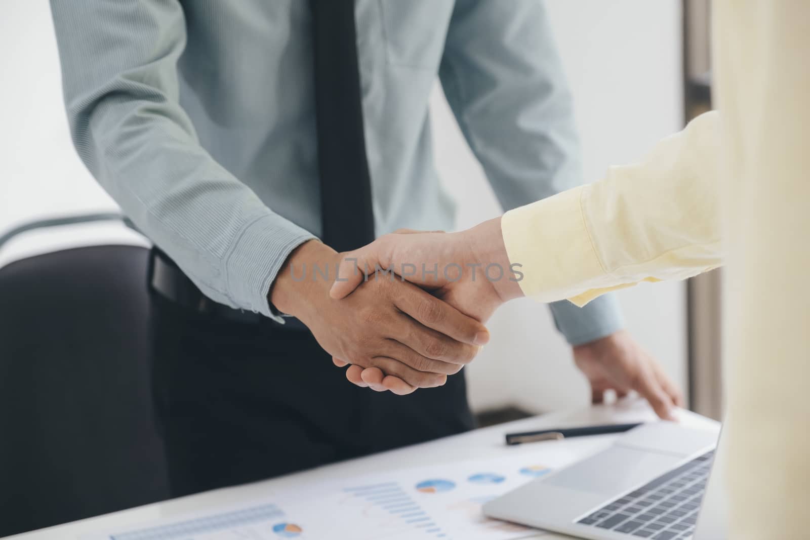 Businessmen handshake after good deal. by ijeab