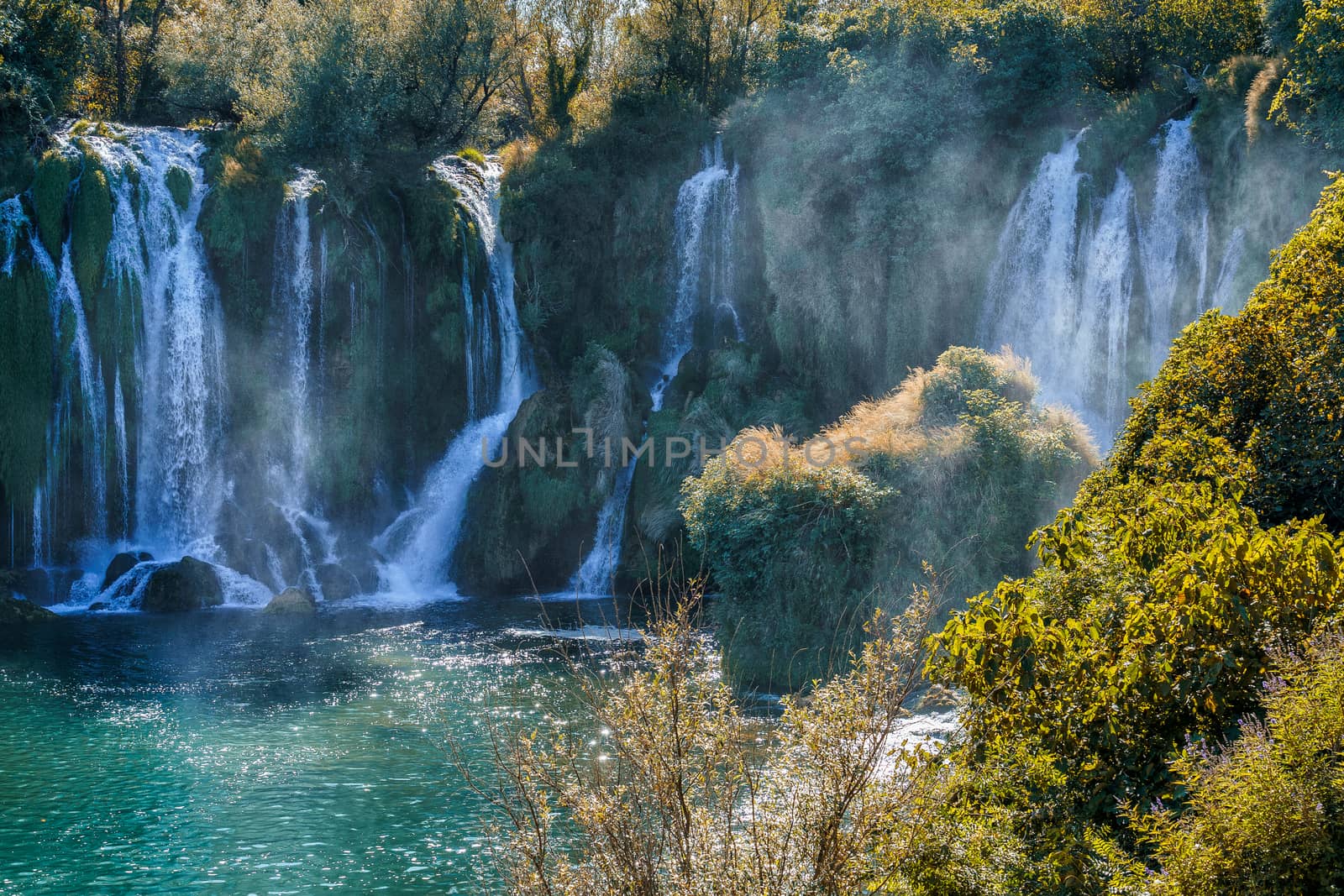 Kravice waterfall in Bosnia and Herzegovina, jets of water falling from a height of twenty-five meters among greenery