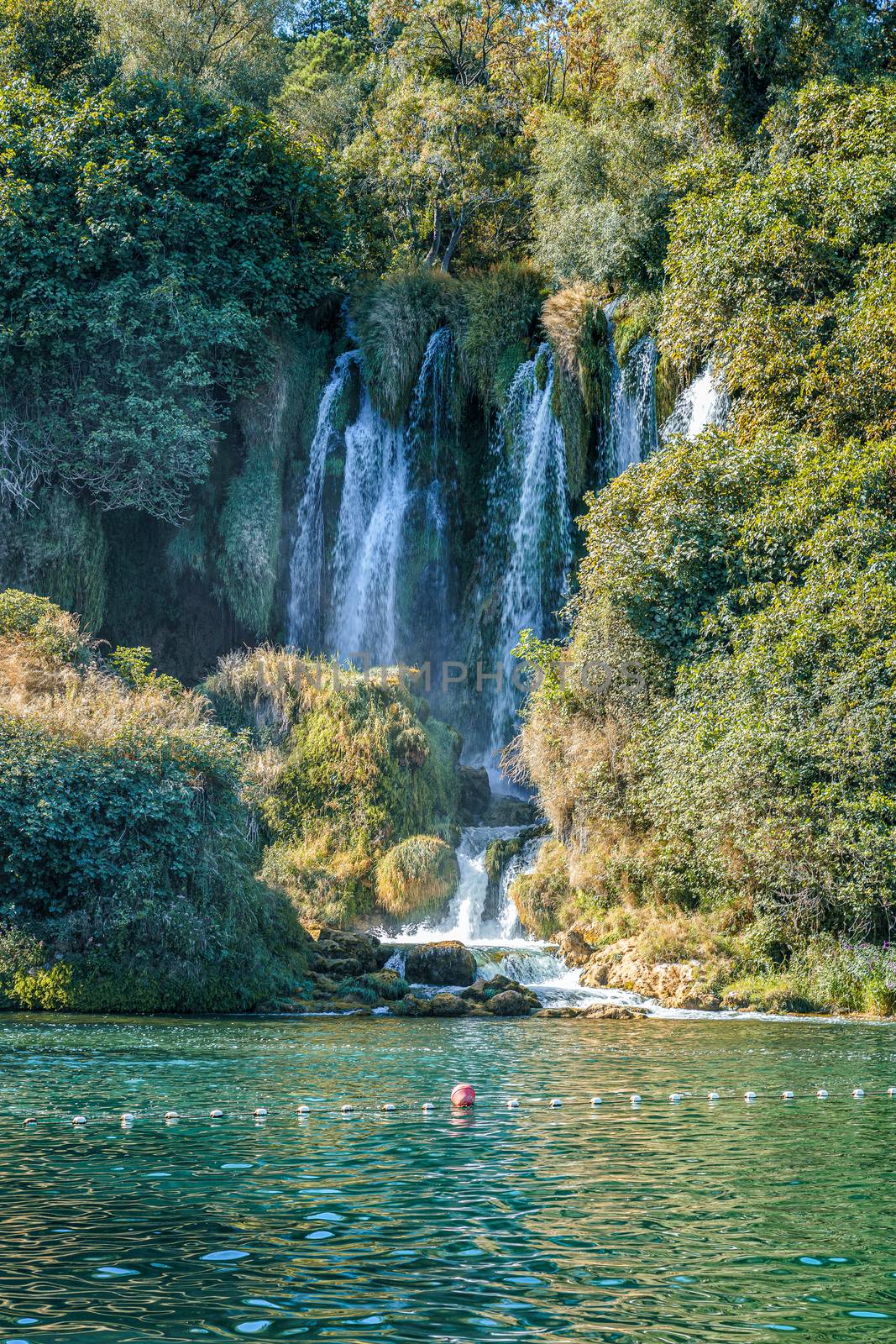 Kravice waterfall in Bosnia and Herzegovina, jets of water falling from a height of twenty-five meters among greenery