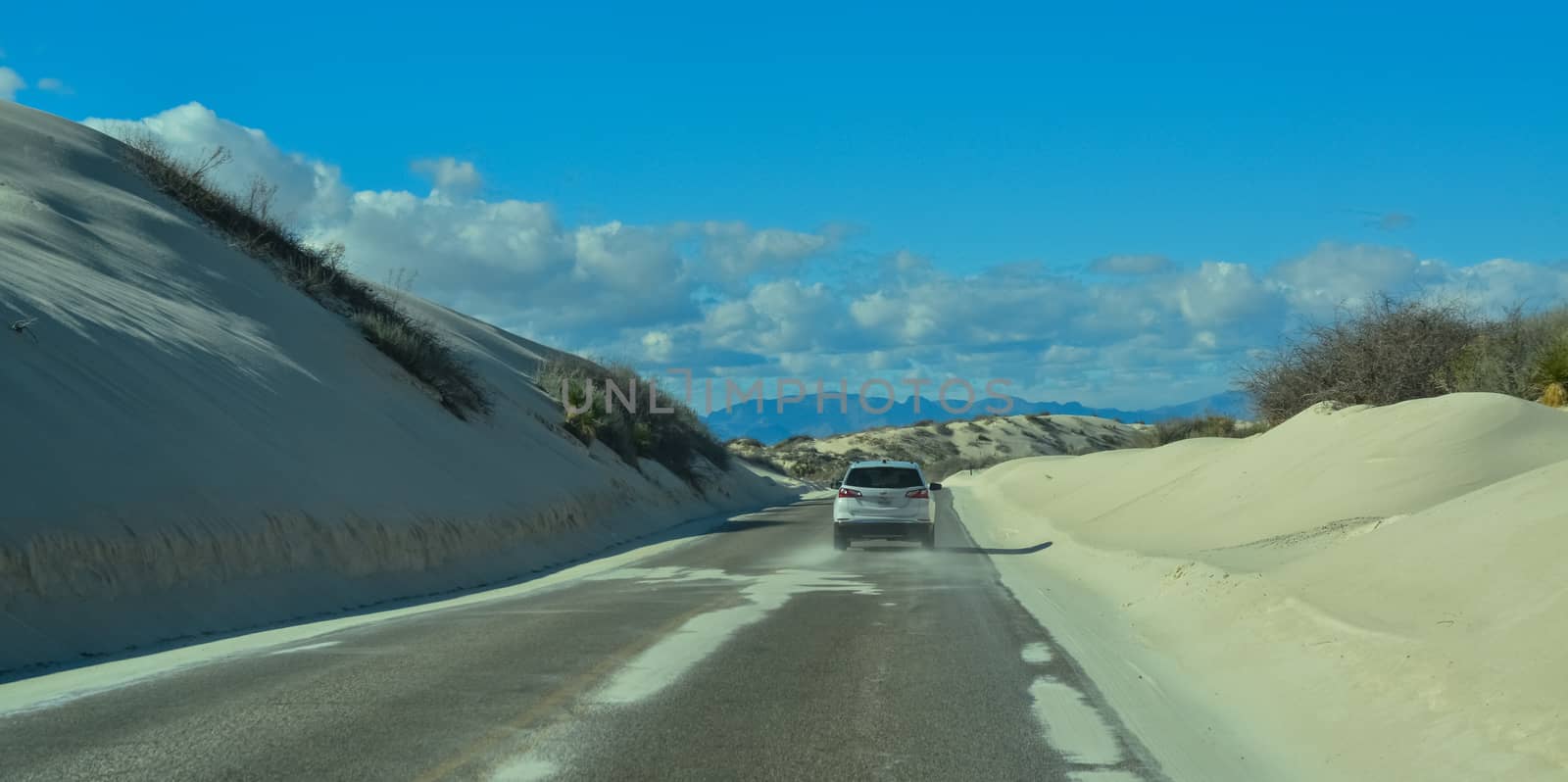 car rides the harms of sand dunes from gypsum to White Sands National Monument, New Mexico, USA by Hydrobiolog