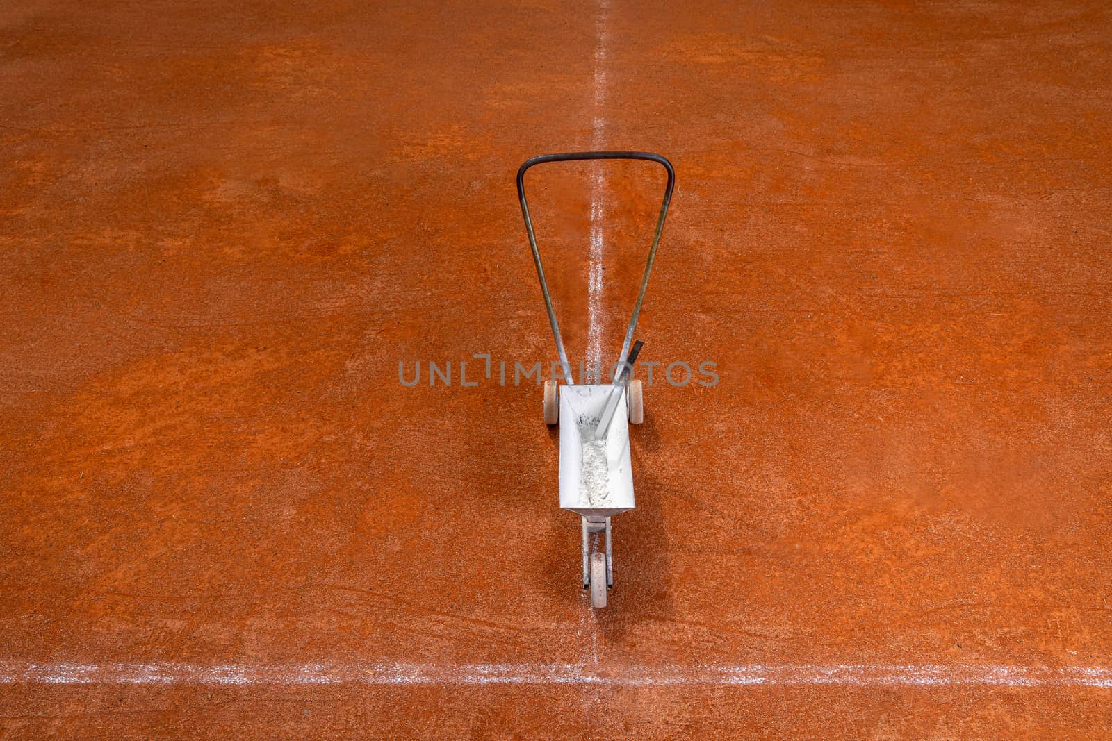 maintenance and repair of tennis courts. drawing white lines with lime by Edophoto