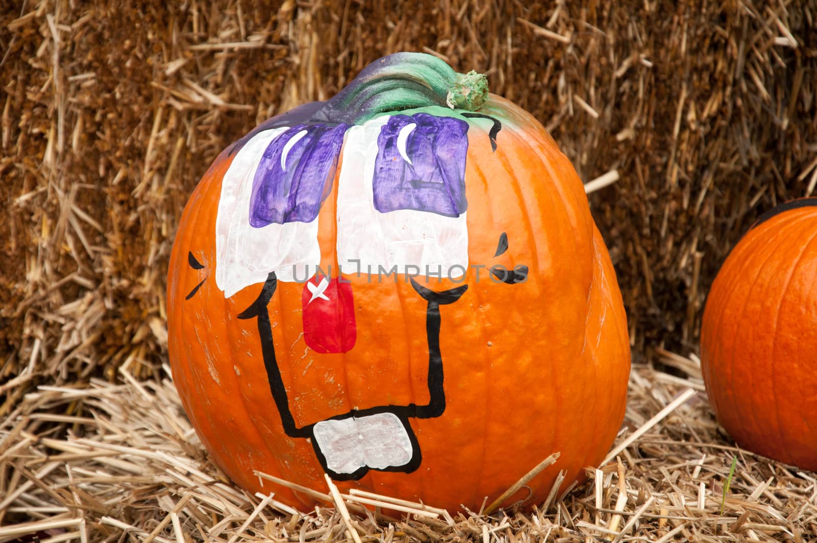 A face painted on a pumpkin