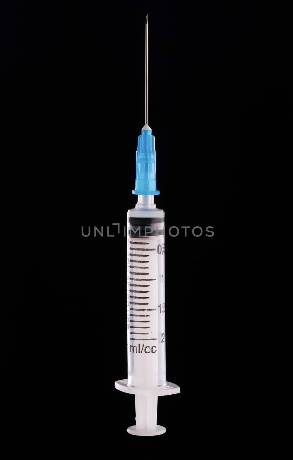 medical syringe on a dark background by A_Karim